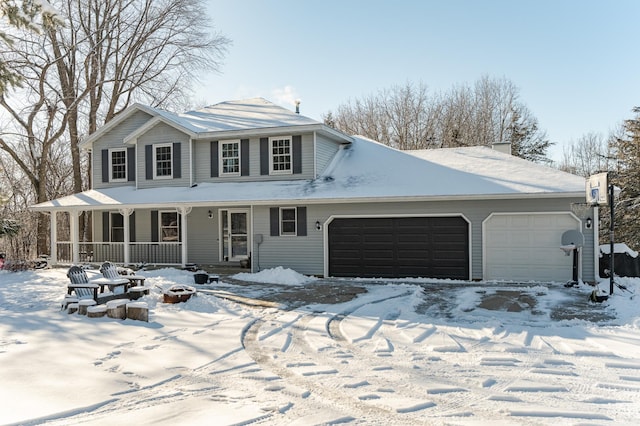 view of front of house featuring a porch and an attached garage