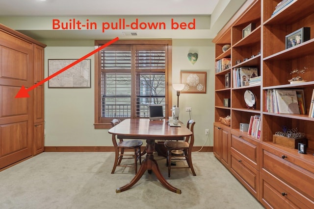 dining room featuring light colored carpet, visible vents, and baseboards