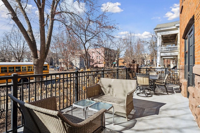 balcony featuring outdoor dining space