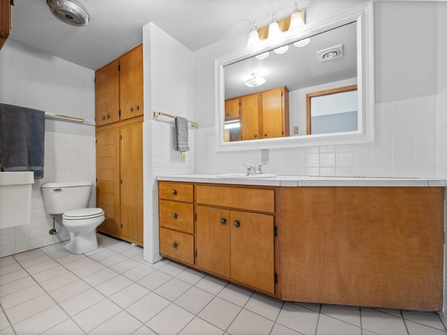 17170 Highview Ave, Minnewaska Twp, MN 56334 - bathroom with vanity, toilet, tile walls, and tile patterned flooring