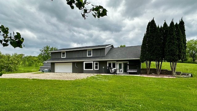 17170 Highview Ave, Minnewaska Twp, MN 56334 - view of front of house featuring dirt driveway, a garage, a front yard, and a shingled roof