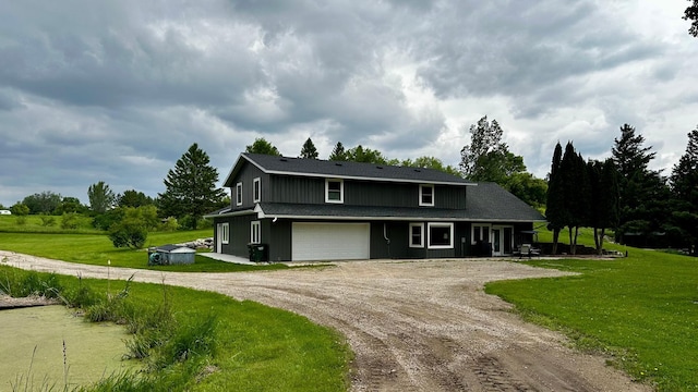17170 Highview Ave, Minnewaska Twp, MN 56334 - view of front of home featuring driveway, a garage, and a front lawn