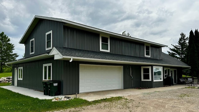 17170 Highview Ave, Minnewaska Twp, MN 56334 - view of front facade featuring an attached garage, dirt driveway, and board and batten siding