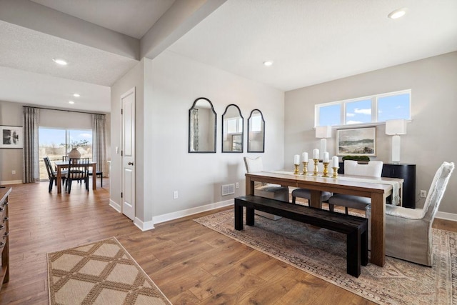 dining area with recessed lighting, wood finished floors, and baseboards