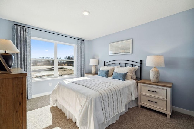 bedroom featuring carpet floors and baseboards