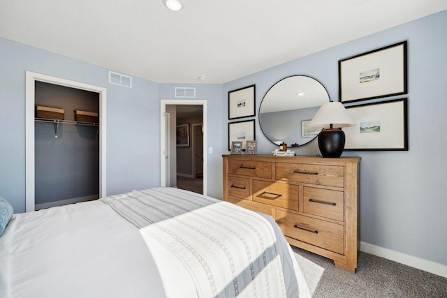 bedroom with baseboards, visible vents, and carpet flooring