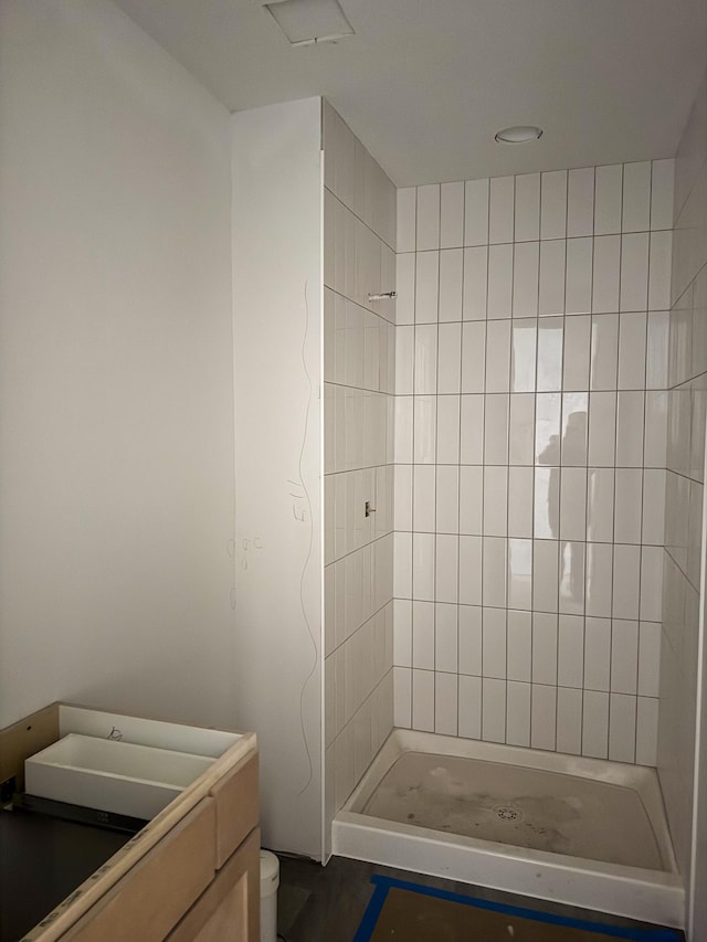 full bathroom featuring toilet, a shower stall, and vanity
