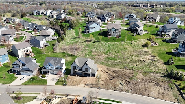 birds eye view of property with a residential view