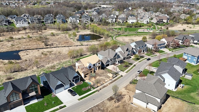 birds eye view of property featuring a residential view and a water view