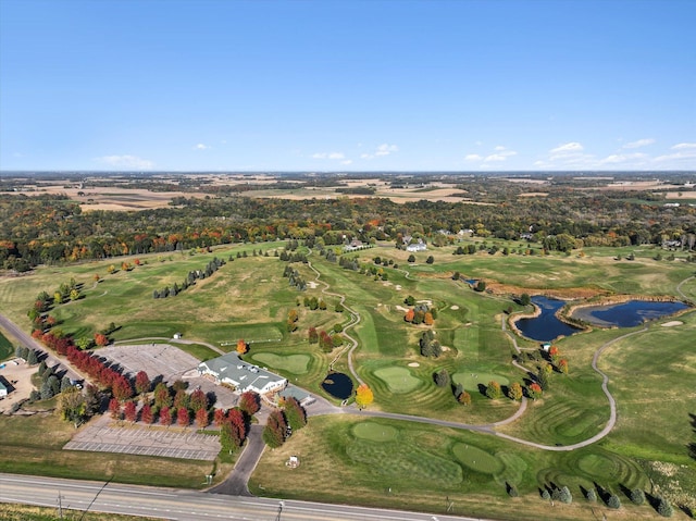 aerial view featuring a water view and golf course view