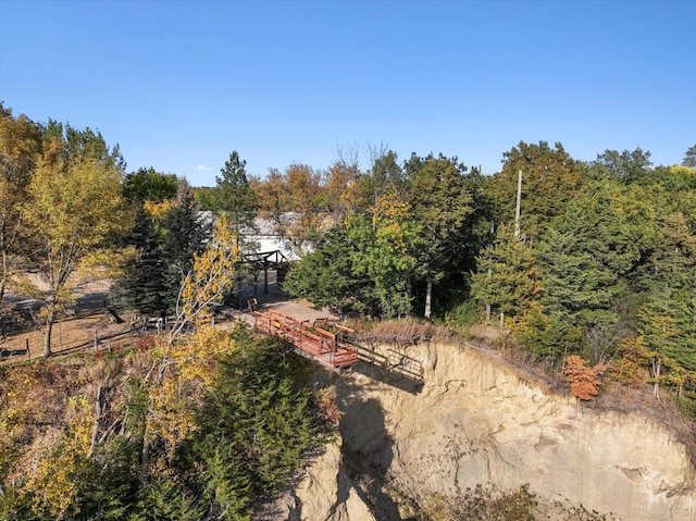 birds eye view of property with a wooded view