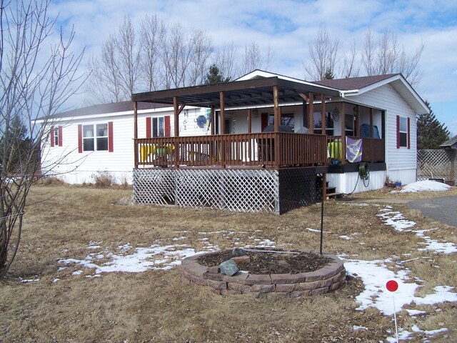 view of front facade with an outdoor fire pit