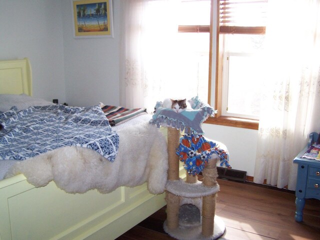 bedroom with wood finished floors