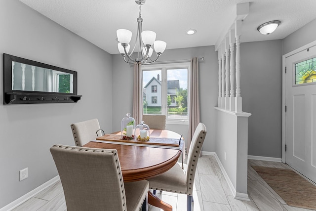 607 Adams St NE, Minneapolis, MN 55413 - dining room featuring a chandelier, baseboards, a textured ceiling, and recessed lighting