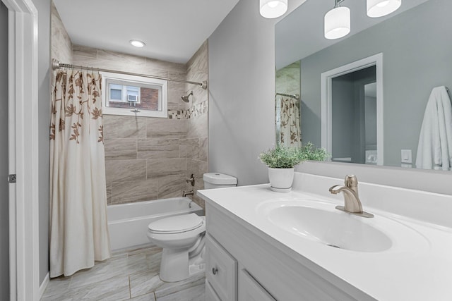 607 Adams St NE, Minneapolis, MN 55413 - full bathroom with vanity, toilet, and shower / bath combo