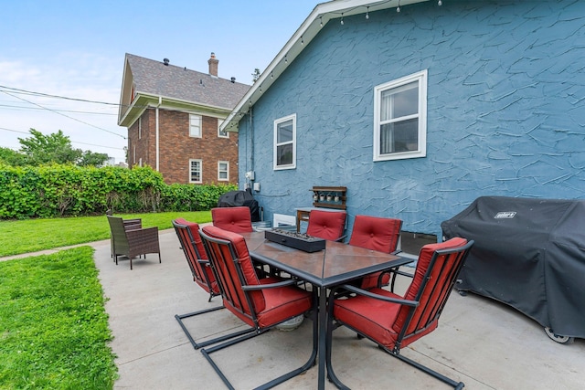 607 Adams St NE, Minneapolis, MN 55413 - view of patio featuring outdoor dining space and a grill