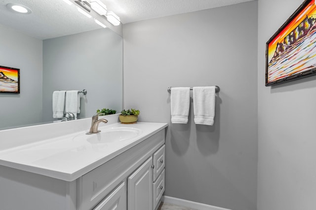 607 Adams St NE, Minneapolis, MN 55413 - bathroom featuring vanity and a textured ceiling