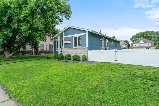 607 Adams St NE, Minneapolis, MN 55413 - view of front of property with a gate, stucco siding, and brick siding