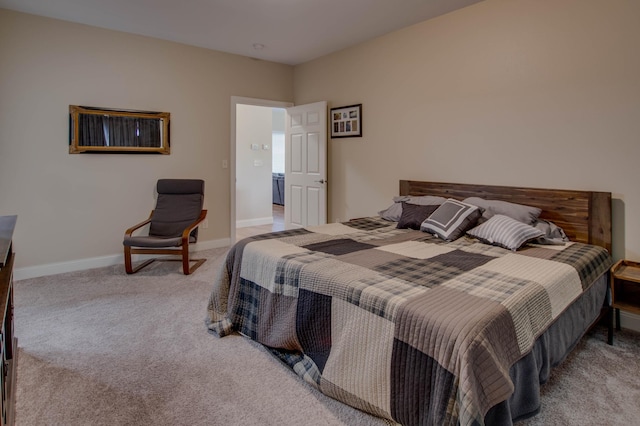 carpeted bedroom with baseboards