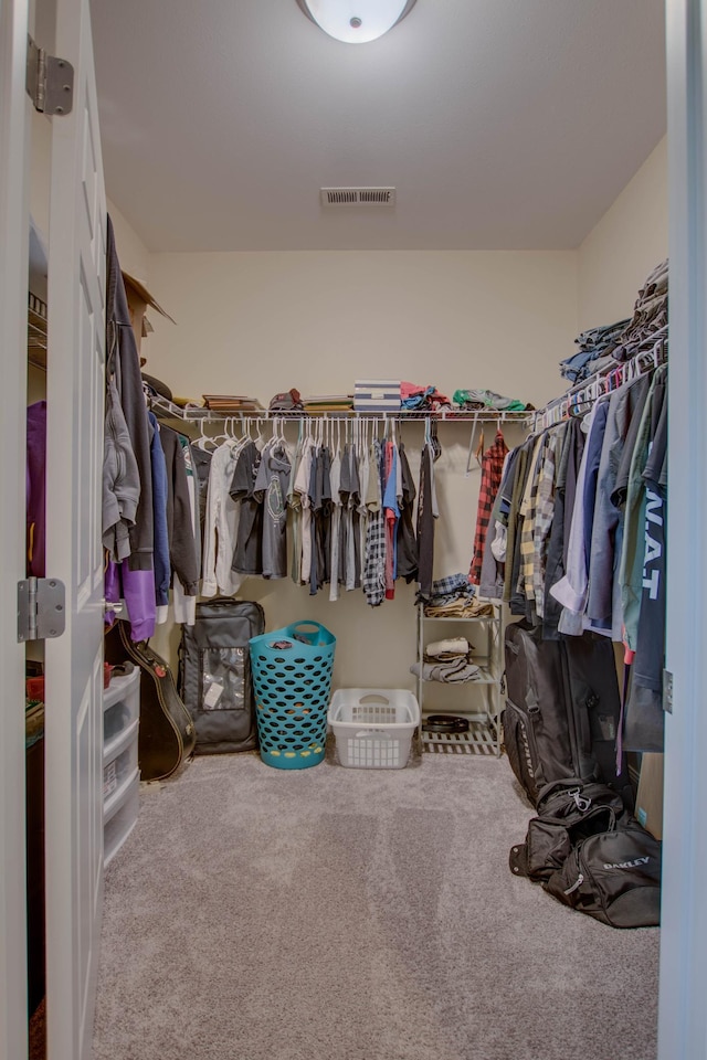 walk in closet with carpet and visible vents