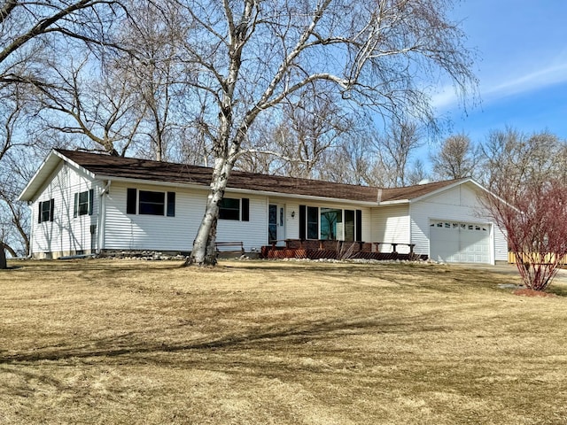 ranch-style house with driveway, a front lawn, a porch, and an attached garage