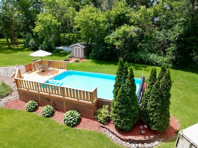 1001 1st Ave NW, Pelican Rapids, MN 56572 - outdoor pool featuring a storage unit, a wooden deck, a yard, and outdoor dining space