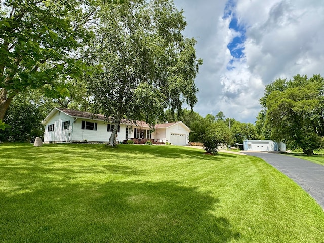1001 1st Ave NW, Pelican Rapids, MN 56572 - view of front of property with a front lawn and asphalt driveway