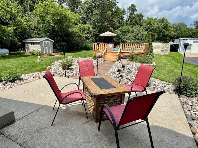 1001 1st Ave NW, Pelican Rapids, MN 56572 - view of patio featuring a shed, outdoor dining space, a deck, and view of scattered trees