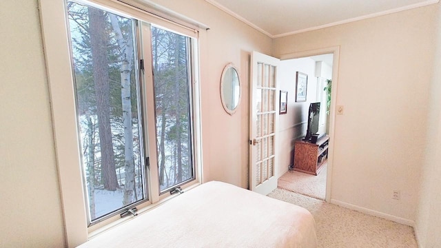 bedroom featuring ornamental molding, carpet, multiple windows, and baseboards