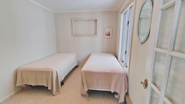 bedroom with baseboards and ornamental molding