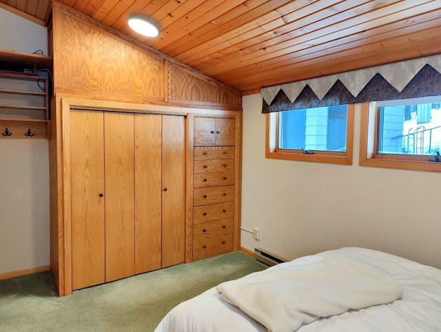 bedroom featuring baseboards, lofted ceiling, wood ceiling, baseboard heating, and carpet flooring