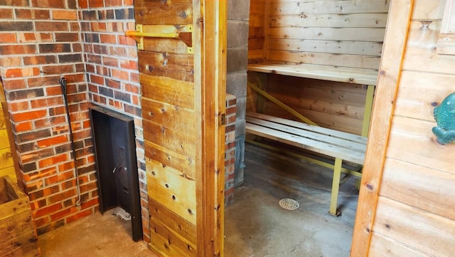 view of sauna featuring unfinished concrete flooring