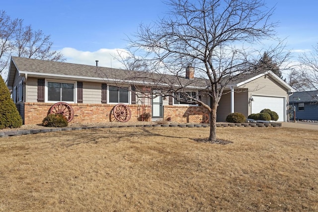 single story home featuring driveway, a front lawn, a garage, brick siding, and a chimney