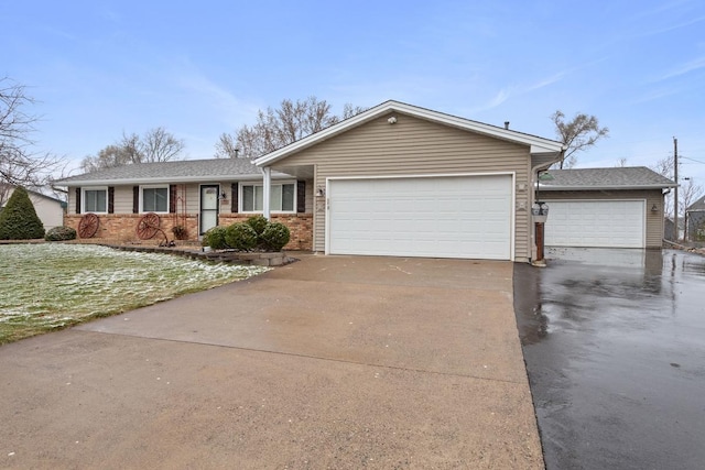 ranch-style home with brick siding, a garage, and driveway