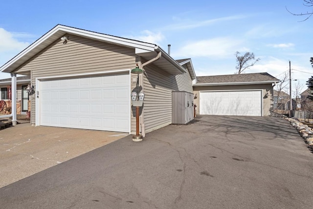 exterior space with a detached garage