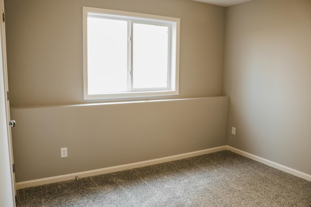 empty room with carpet flooring and baseboards