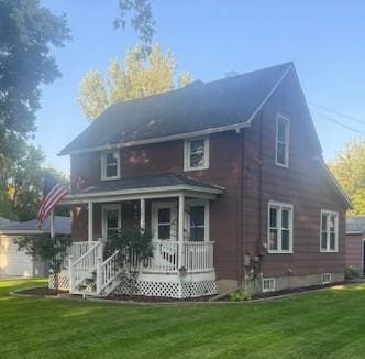 back of property featuring a lawn and covered porch