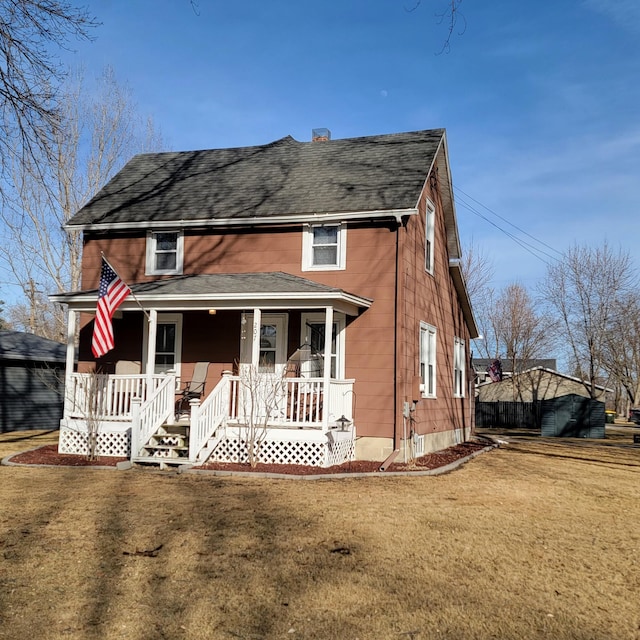 view of front of home featuring covered porch, a front lawn, and a shingled roof