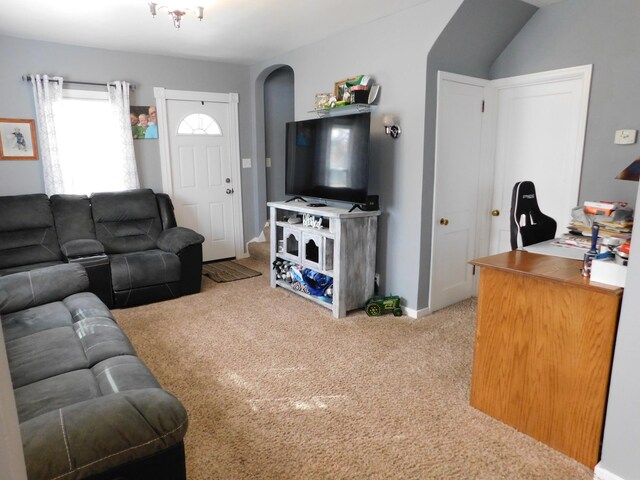 living room with light carpet and baseboards