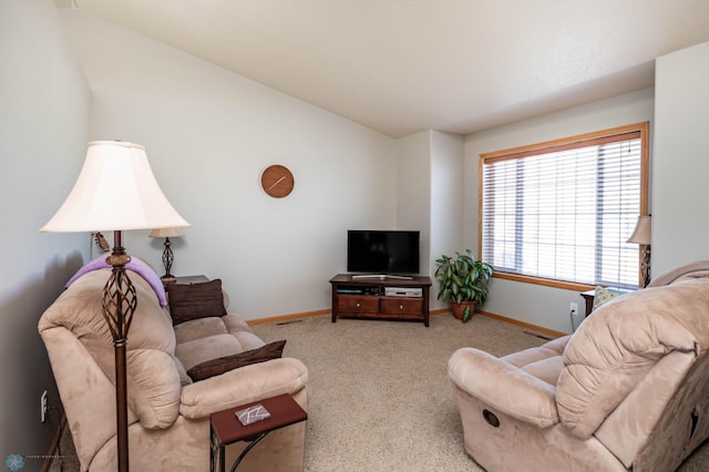 living room featuring carpet flooring and baseboards