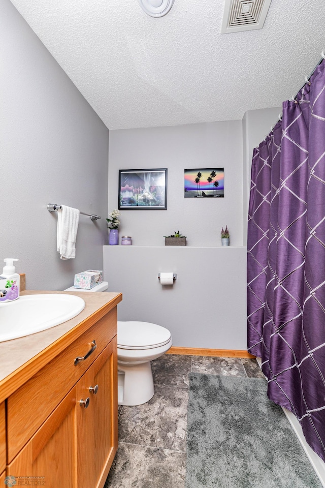 full bathroom with visible vents, toilet, vanity, a shower with curtain, and a textured ceiling