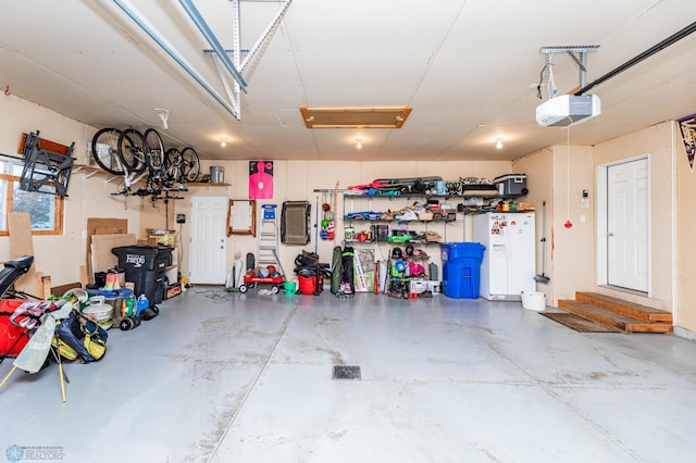 garage featuring a garage door opener and bike storage