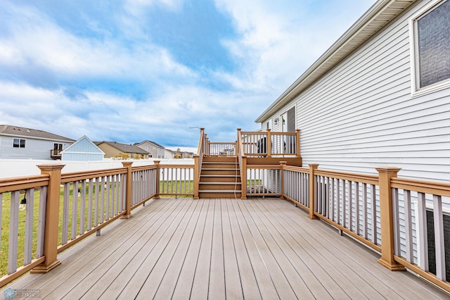 wooden terrace featuring a residential view