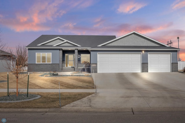 ranch-style home featuring brick siding, concrete driveway, and a garage