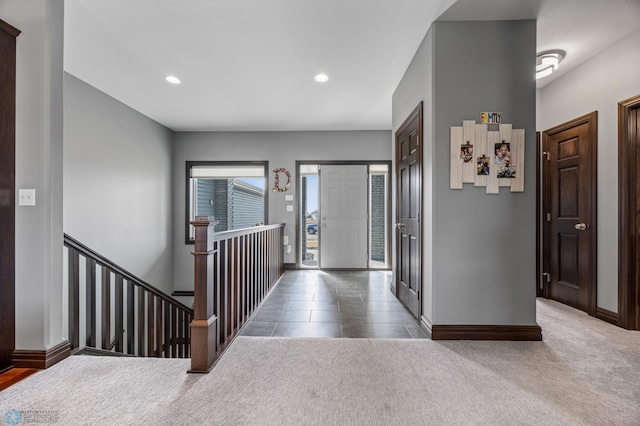 carpeted foyer entrance featuring recessed lighting and baseboards