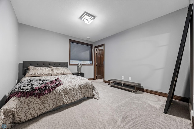 carpeted bedroom with baseboards