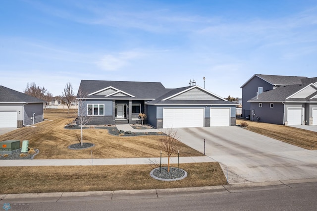 ranch-style home featuring concrete driveway and a garage