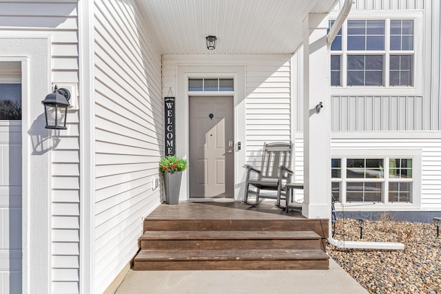 view of exterior entry with covered porch
