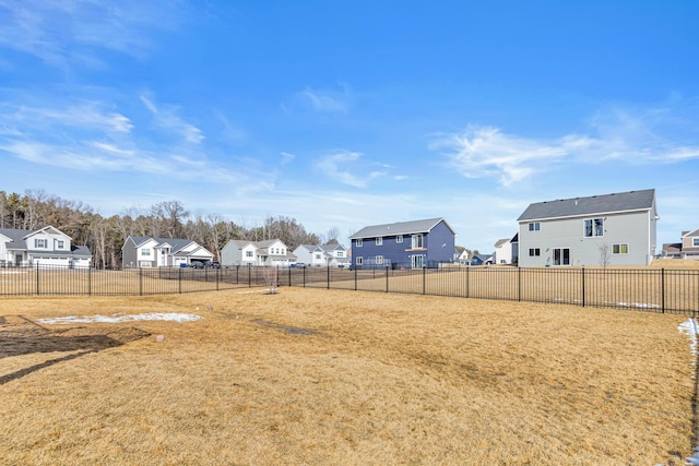 view of yard with a residential view and fence