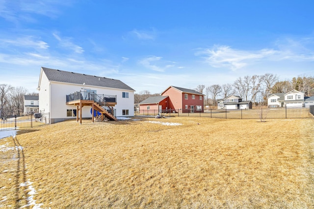 view of yard featuring a fenced backyard and stairs